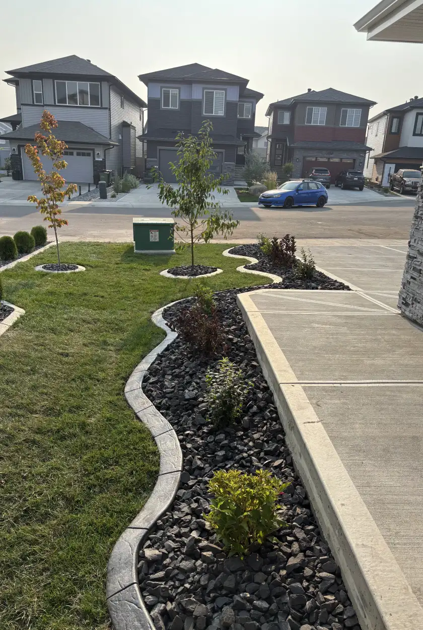 Close-up of a newly installed interlocking brick patio with tight, level edges in Edmonton.