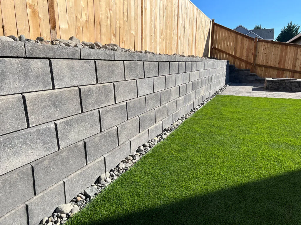 Tiered concrete block retaining wall at an Edmonton residential property.