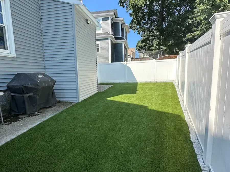 Artificial grass installation on an Edmonton residential yard