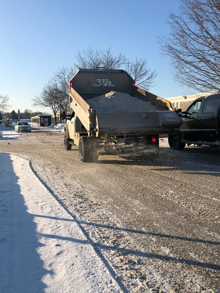 Commercial snow removal costs in Edmonton with salt truck and equipment