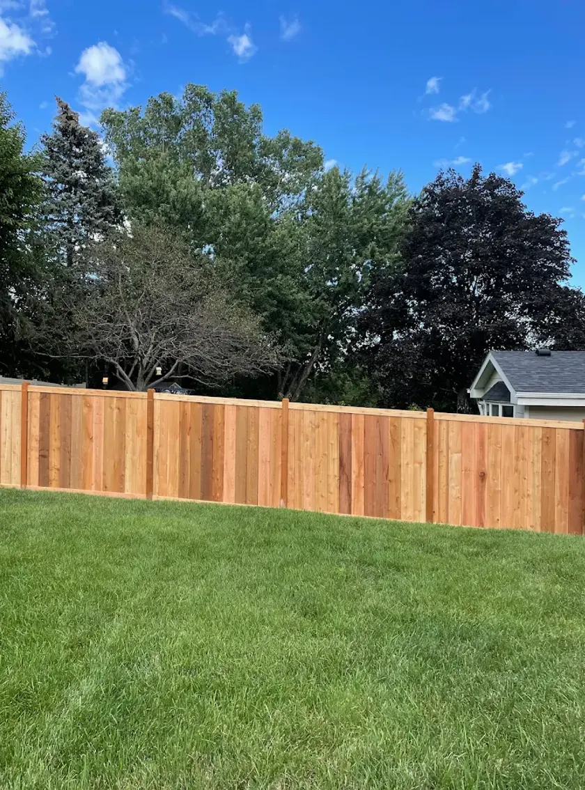 Newly installed pressure-treated wood fence built by Serene Landscaping in Edmonton.