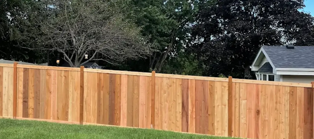 Fence and deck installation by Serene Landscaping at an Edmonton residential property.