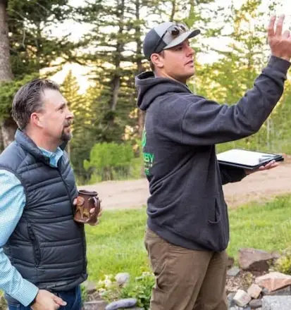 Landscaping contractor providing an onsite consultation for a homeowner in Edmonton.
