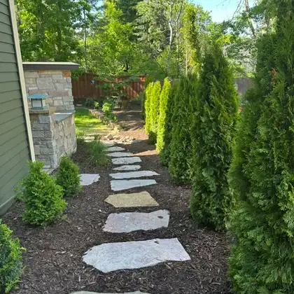 Stepping stone walkway and landscaping project completed by Serene Landscaping.