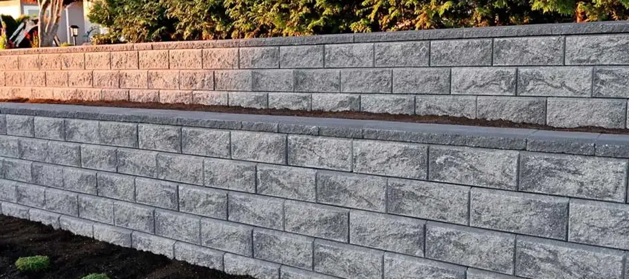 Tiered concrete block retaining wall installed at an Edmonton residential property.