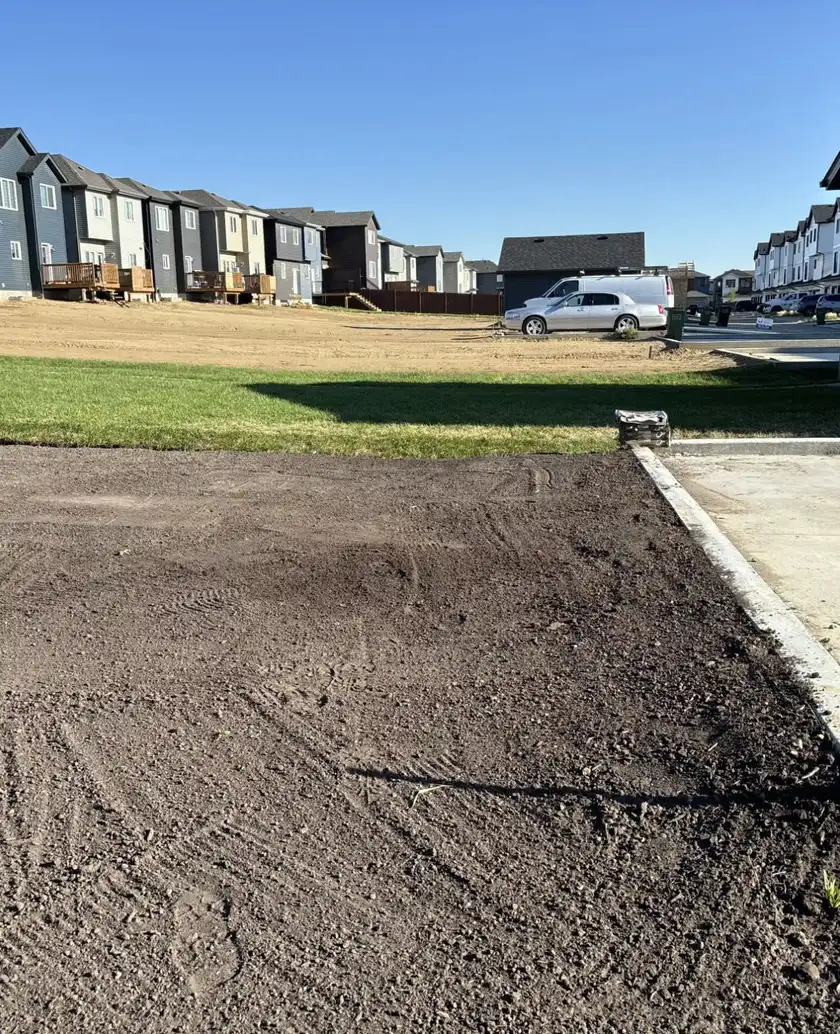 Final grading on a new home front yard in Edmonton by Serene Landscaping.