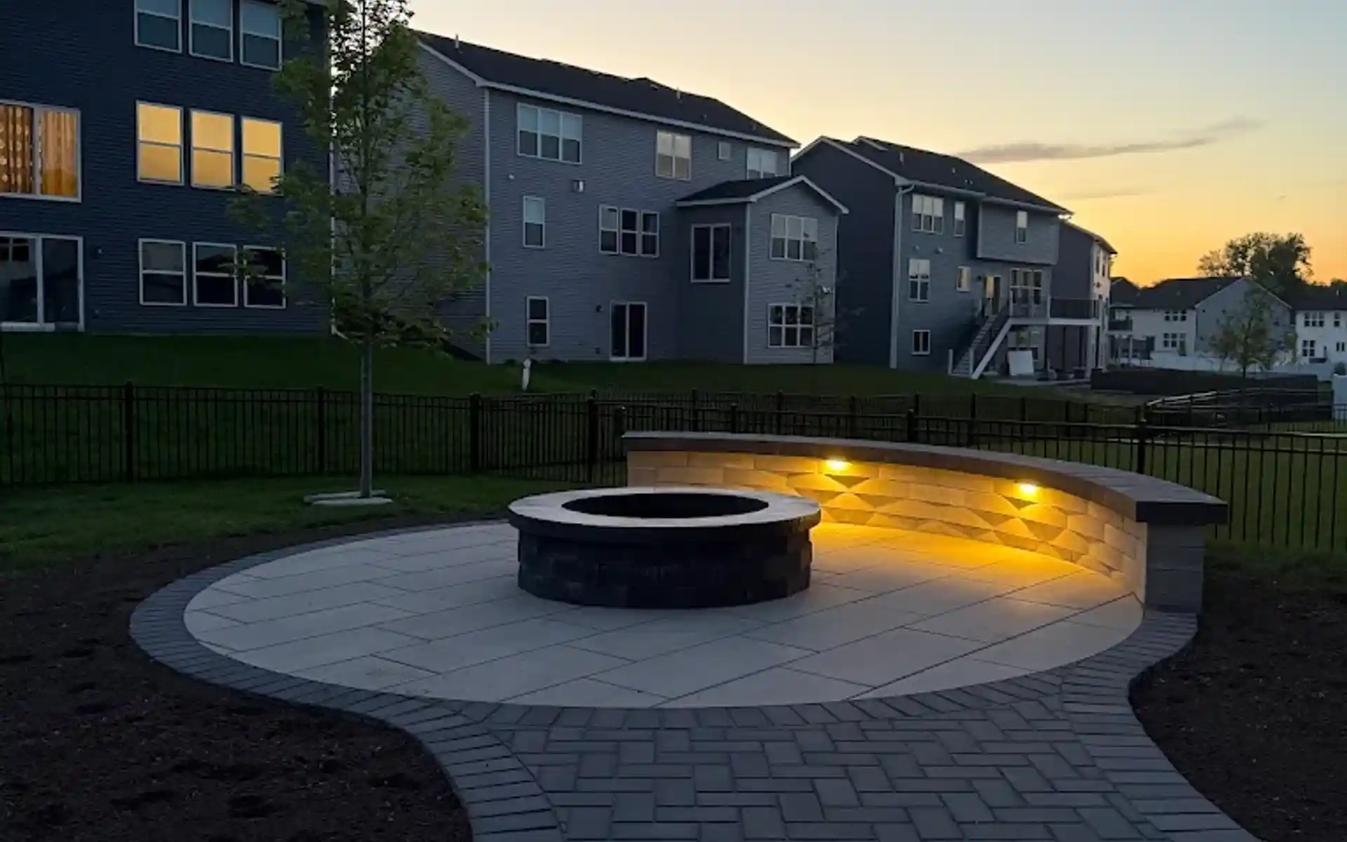 Curved paving stone patio with retaining wall in Edmonton