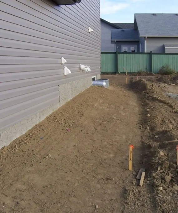 Backyard with proper drainage slope toward swale