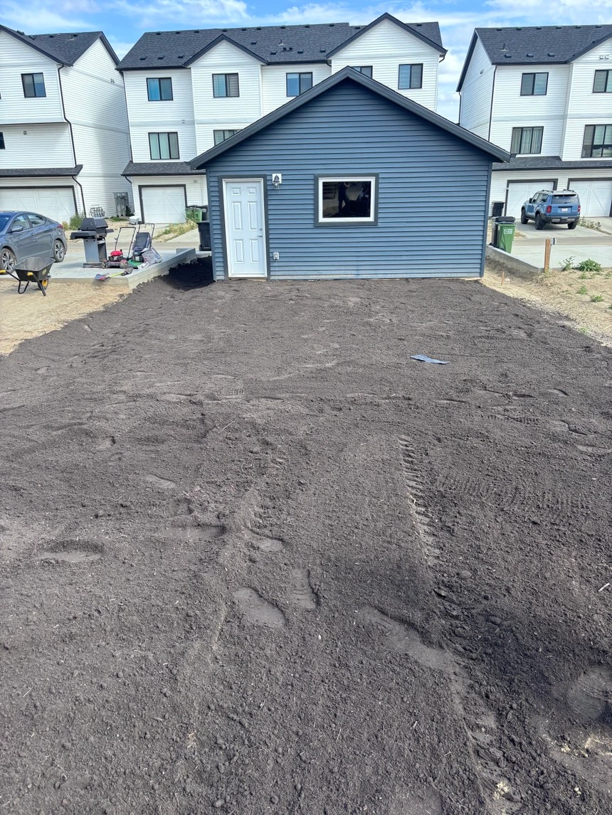 Final grading work on a residential lot.